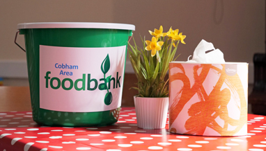 Green Cobham Area Foodbank collecting bucket at the distribution centre